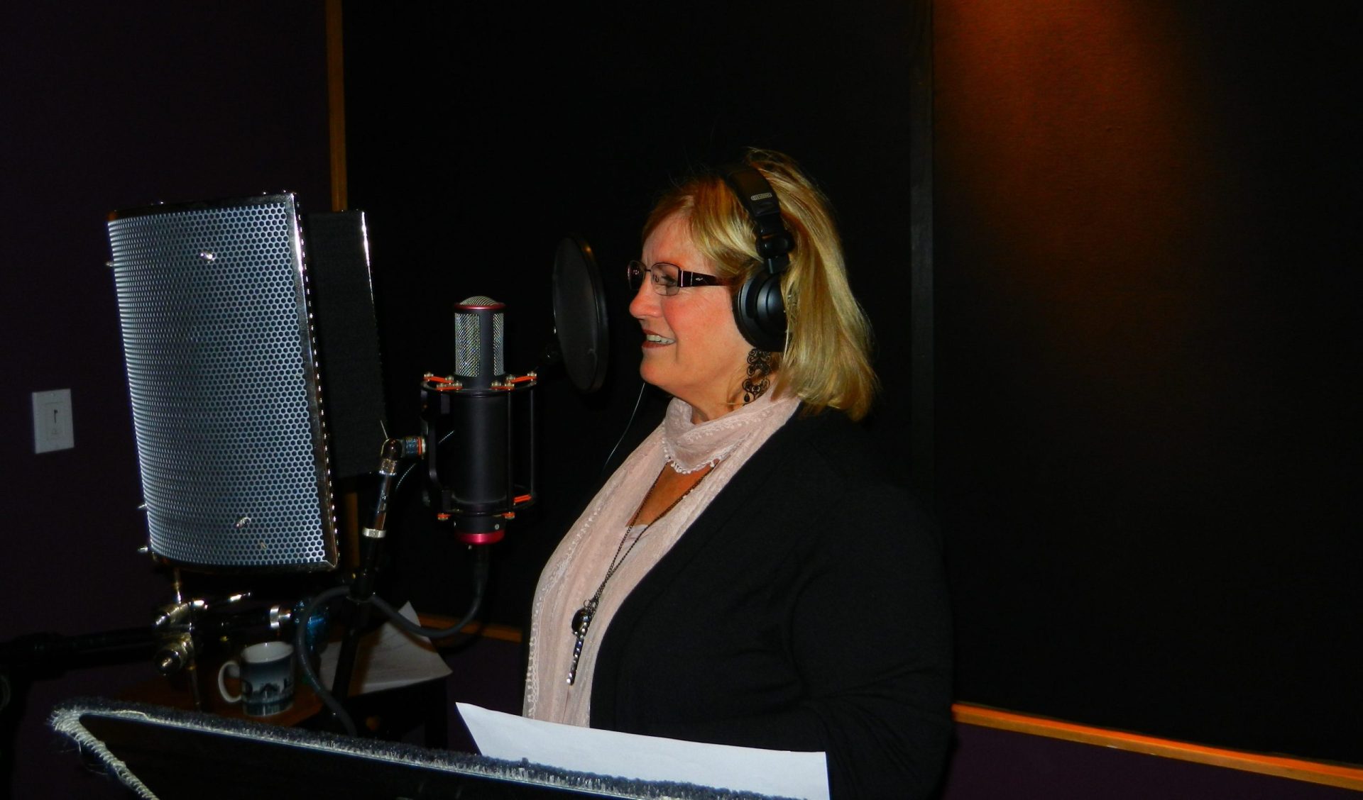 Cissy in the recording studio at the microphone.