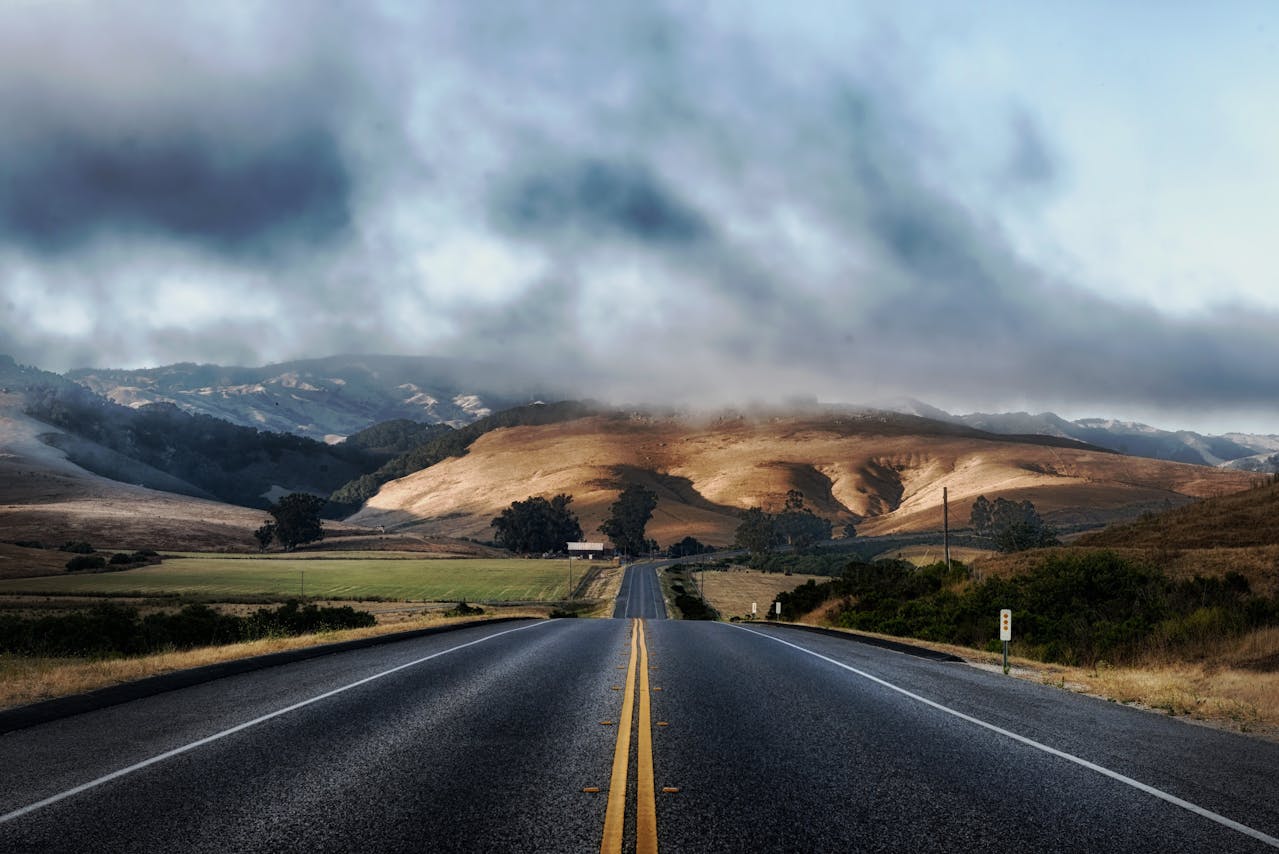 Road into cloud covered mountains