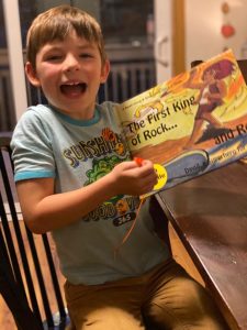 Kodiak boy excited to receive Cissy's King of Rock children's book
